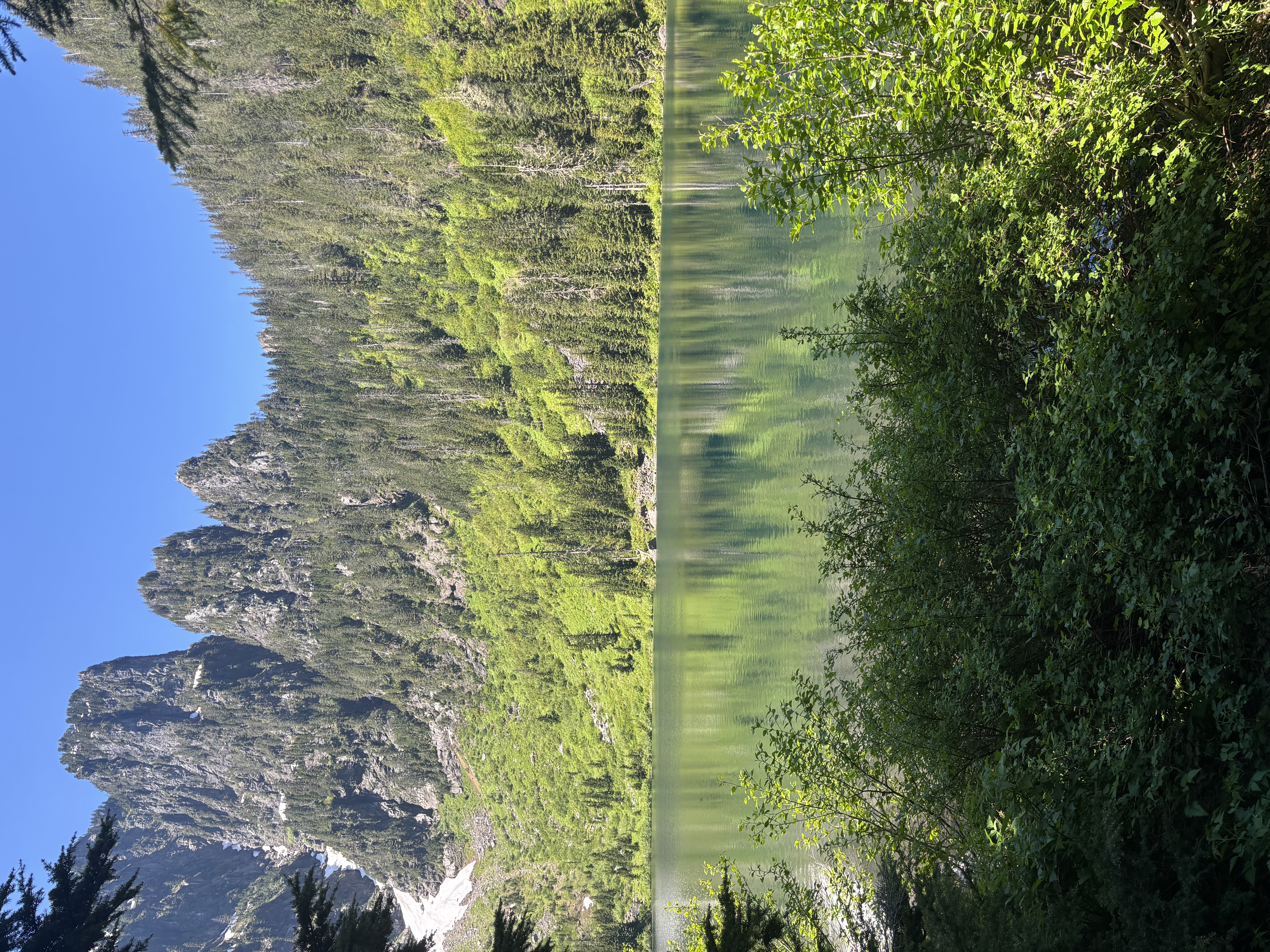 A mountain landscape beneath a clear sky